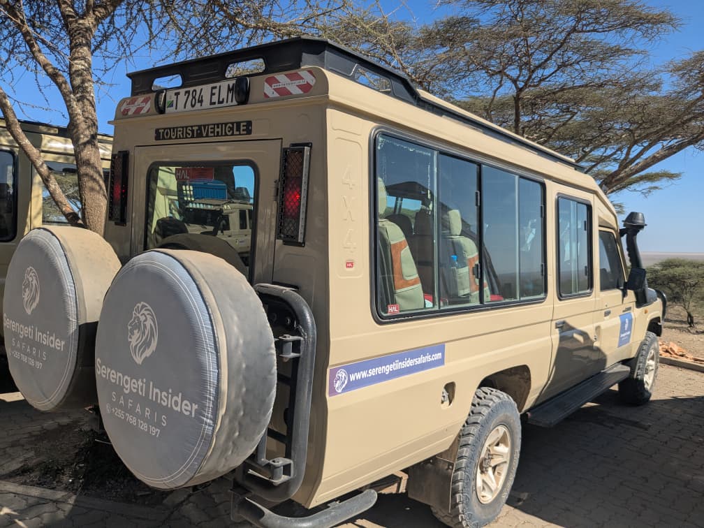 Tourist vehicle of Insider Safaris in Serengeti National Park, Tanzania.