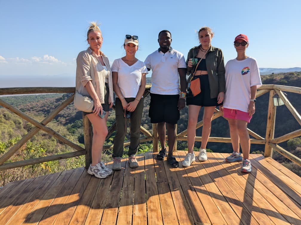 Tourists with their local host enjoying the view at Ngorongoro Crater, Tanzania